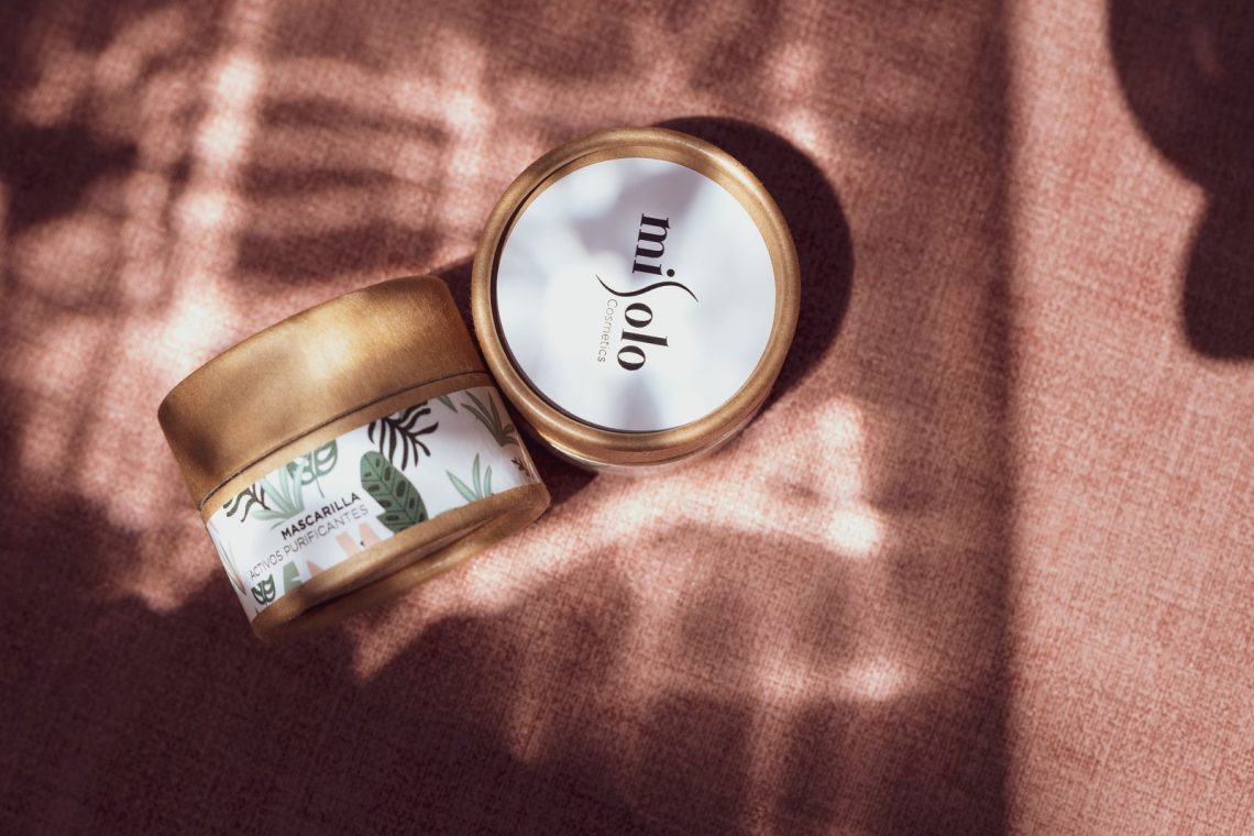 Moisturizer and gentle skincare essentials arranged for colder weather
