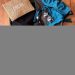 Travel essentials arranged inside an open suitcase